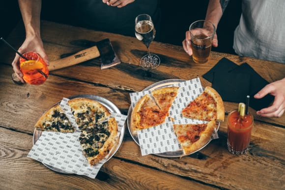 Axe Throwing with Drinks & Pizza Activity Weekend Ideas