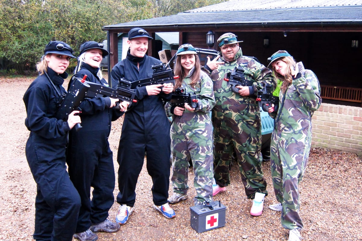 A happy group playing laser tag