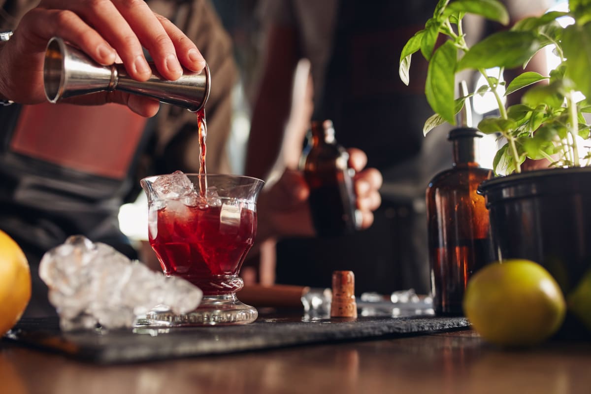 A person having fun during a cocktail making class