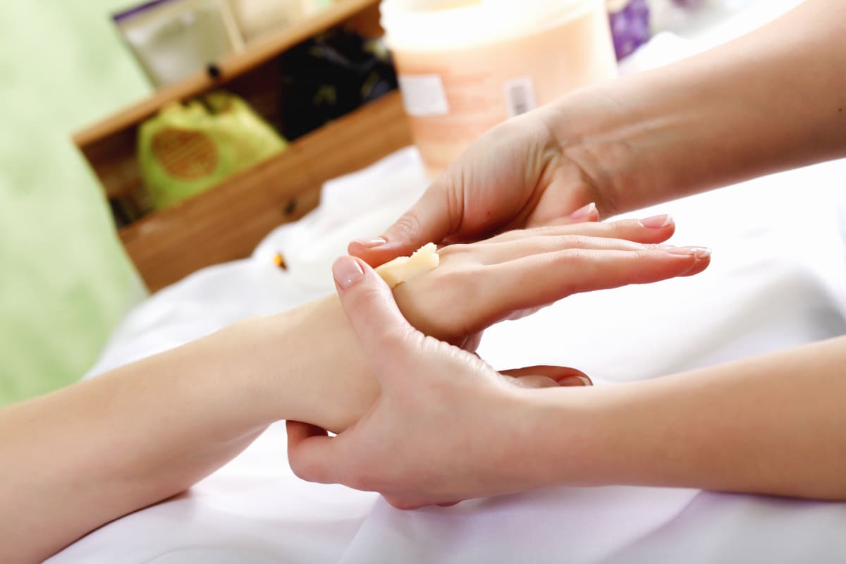 Woman getting manicure