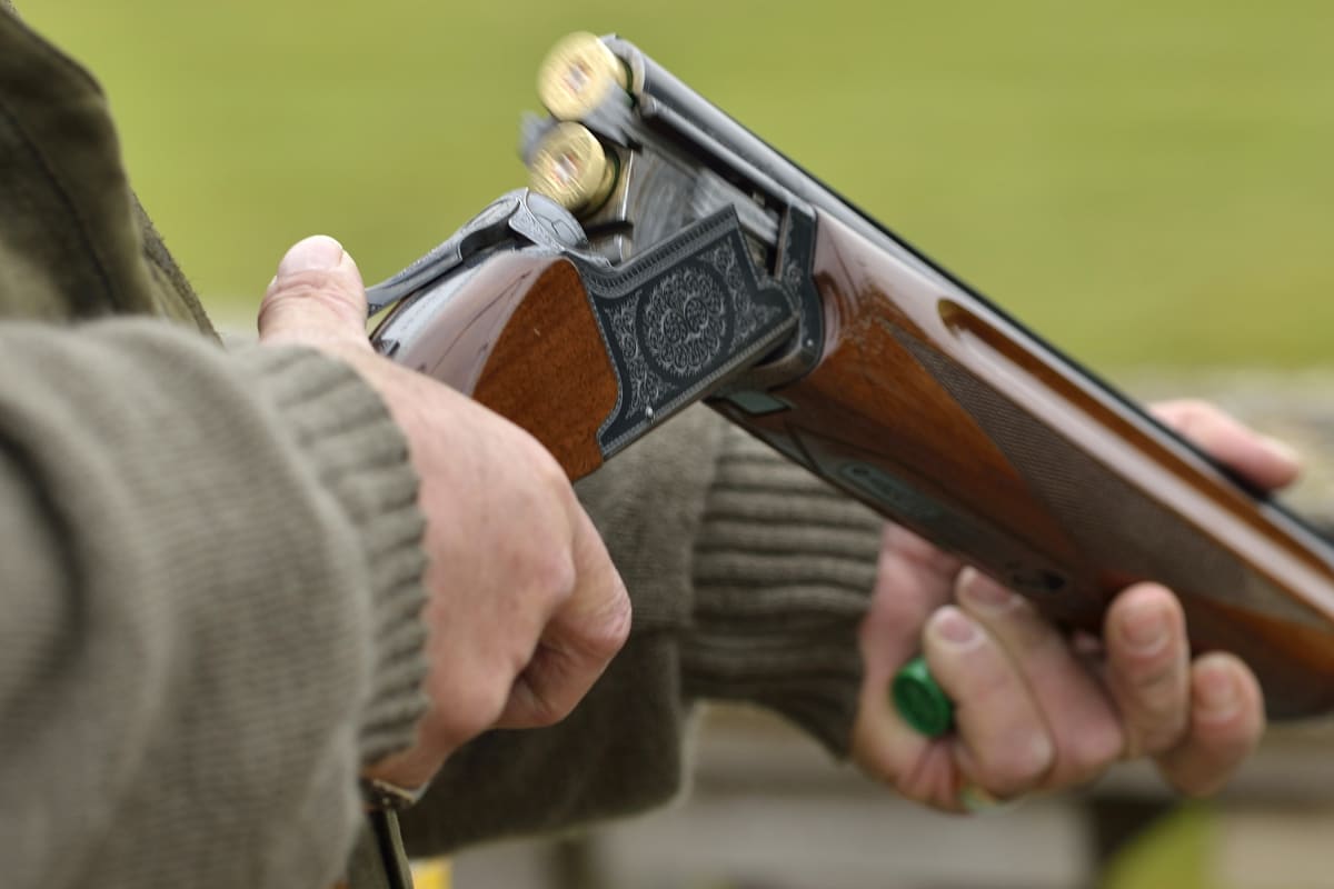 Man loading shot gun during clay pigeon event