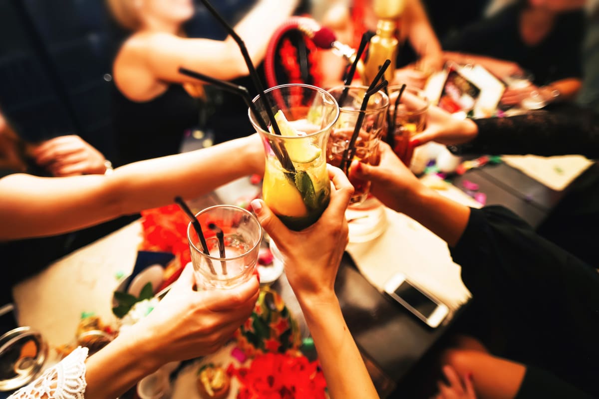 A group of people enjoying drinks in a bar