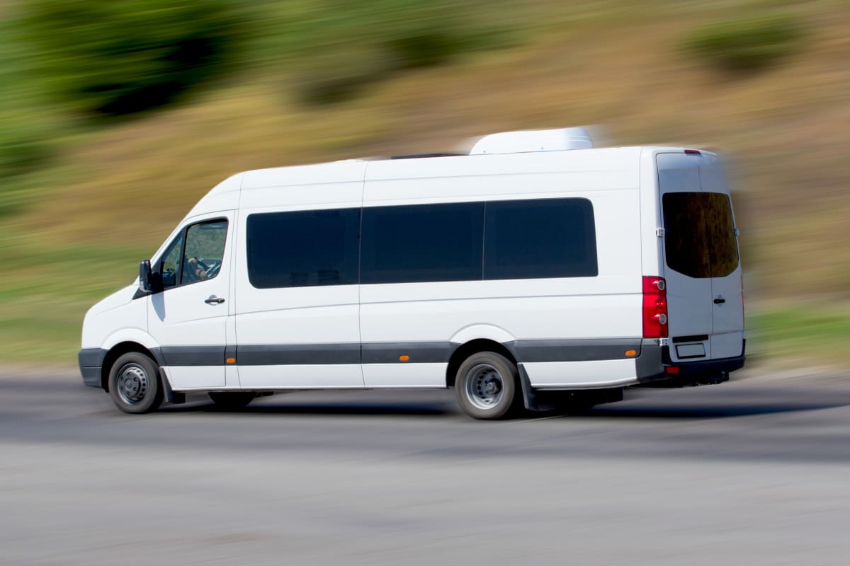 A minibus driving on a road