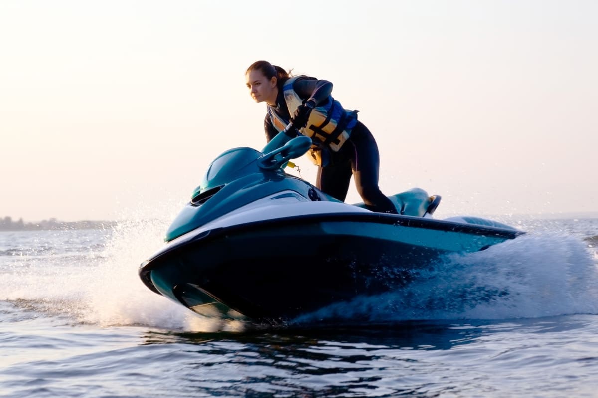 a woman jetskiing