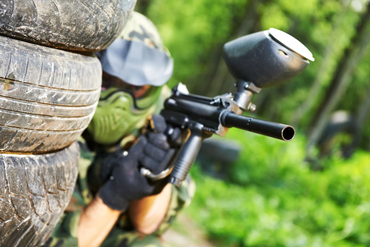 A group of people enjoying a game of paintball