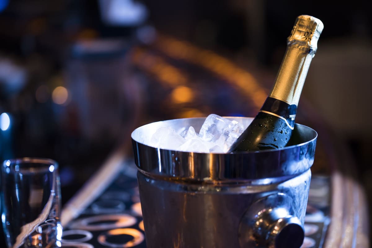 Champagne in Ice Bucket on Bar - VIP tables