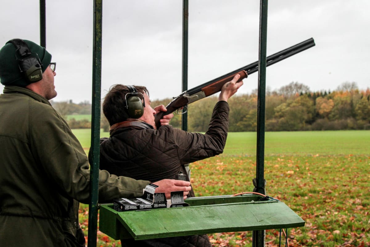A man shooting during clay pigeon activity
