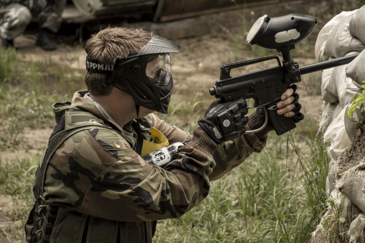 A group of men playing paintball