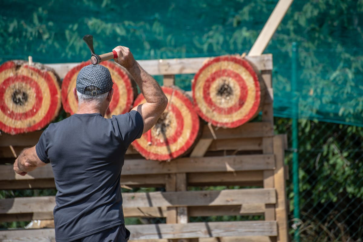 man doing axe throwing