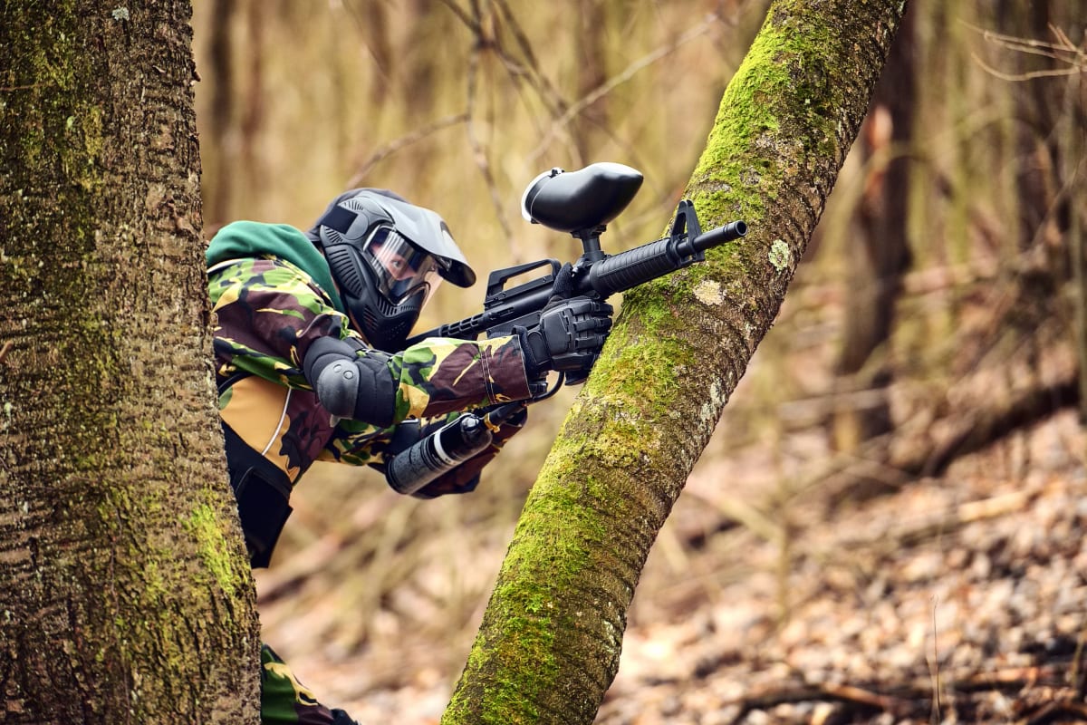 A group of people enjoying a game of paintball