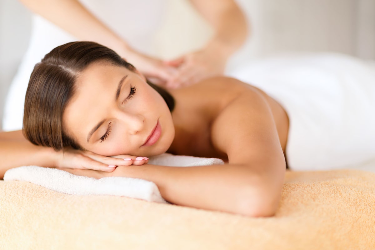 woman receives a massage during a pampering session