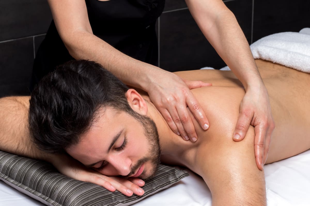A man receiving a massage flip