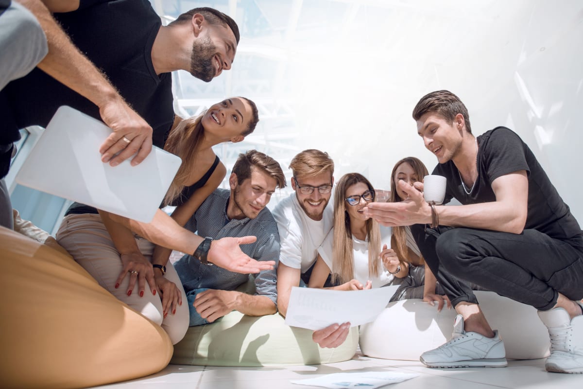 group of casually dressed people discussing plans