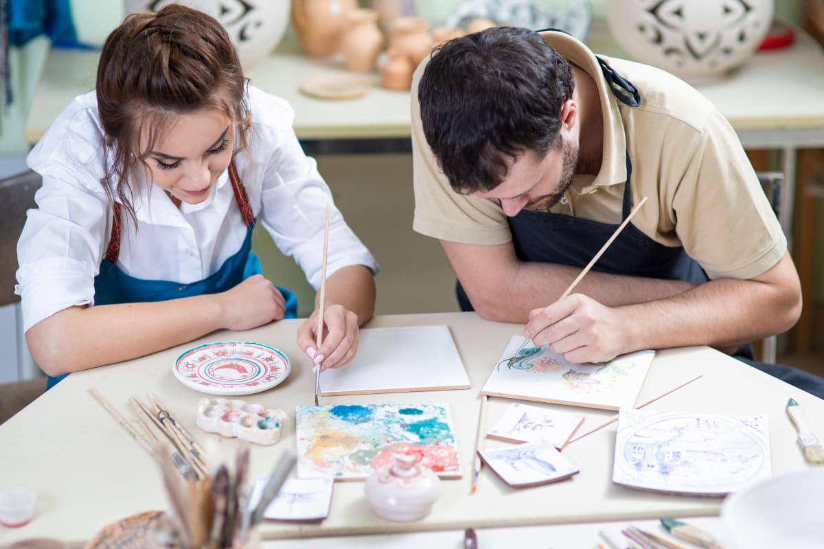 man and woman painting