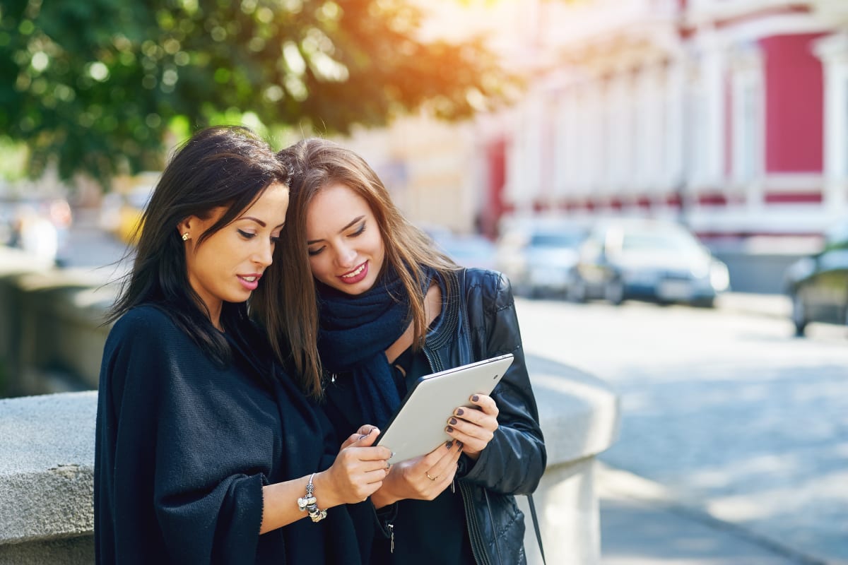 women looking at ipad