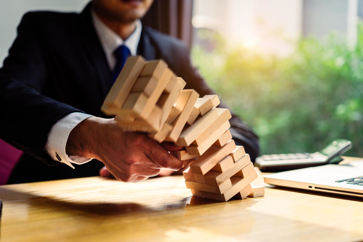 Business man with building blocks