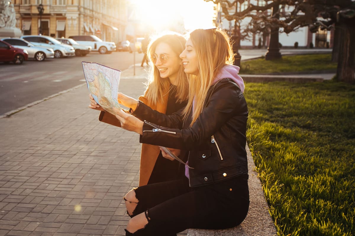 friends looking at map in paris