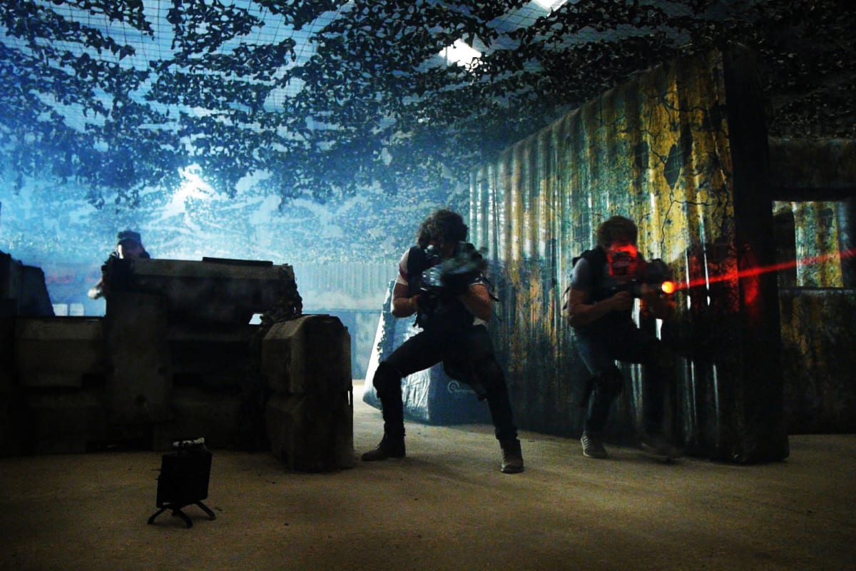 A group playing laser mission