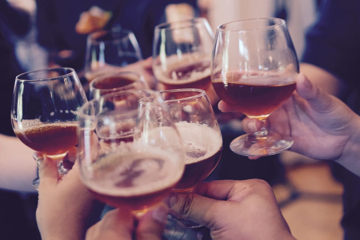 A group of people drinking beers