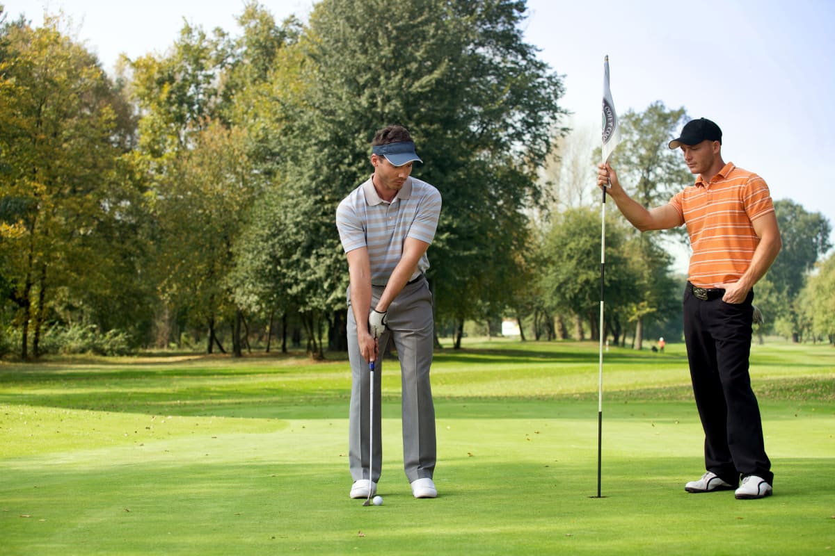 Stag party playing golf on golf course