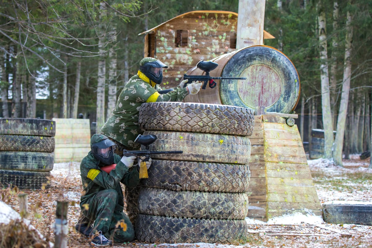 A group of people enjoying a game of paintball