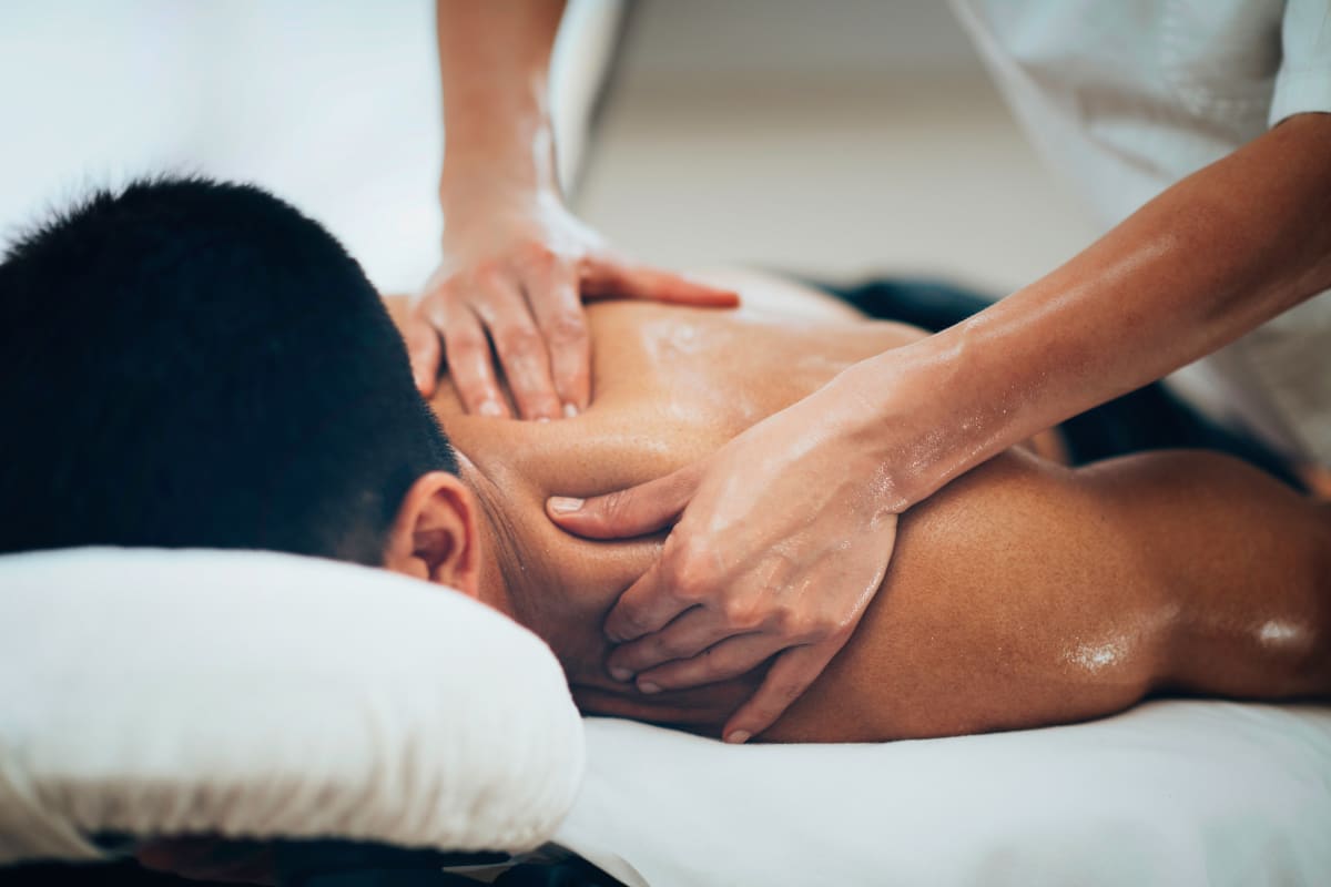 A man receiving a massage during a pamper session