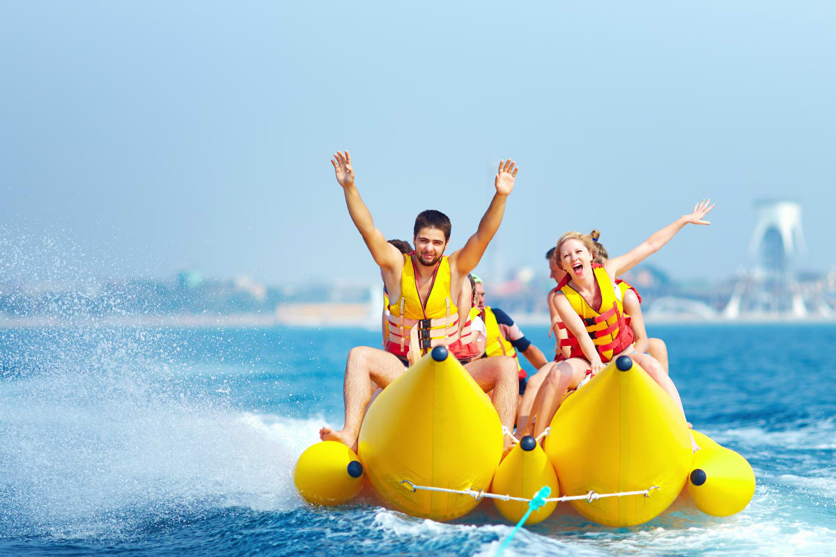 group on a banana boat in the ocean