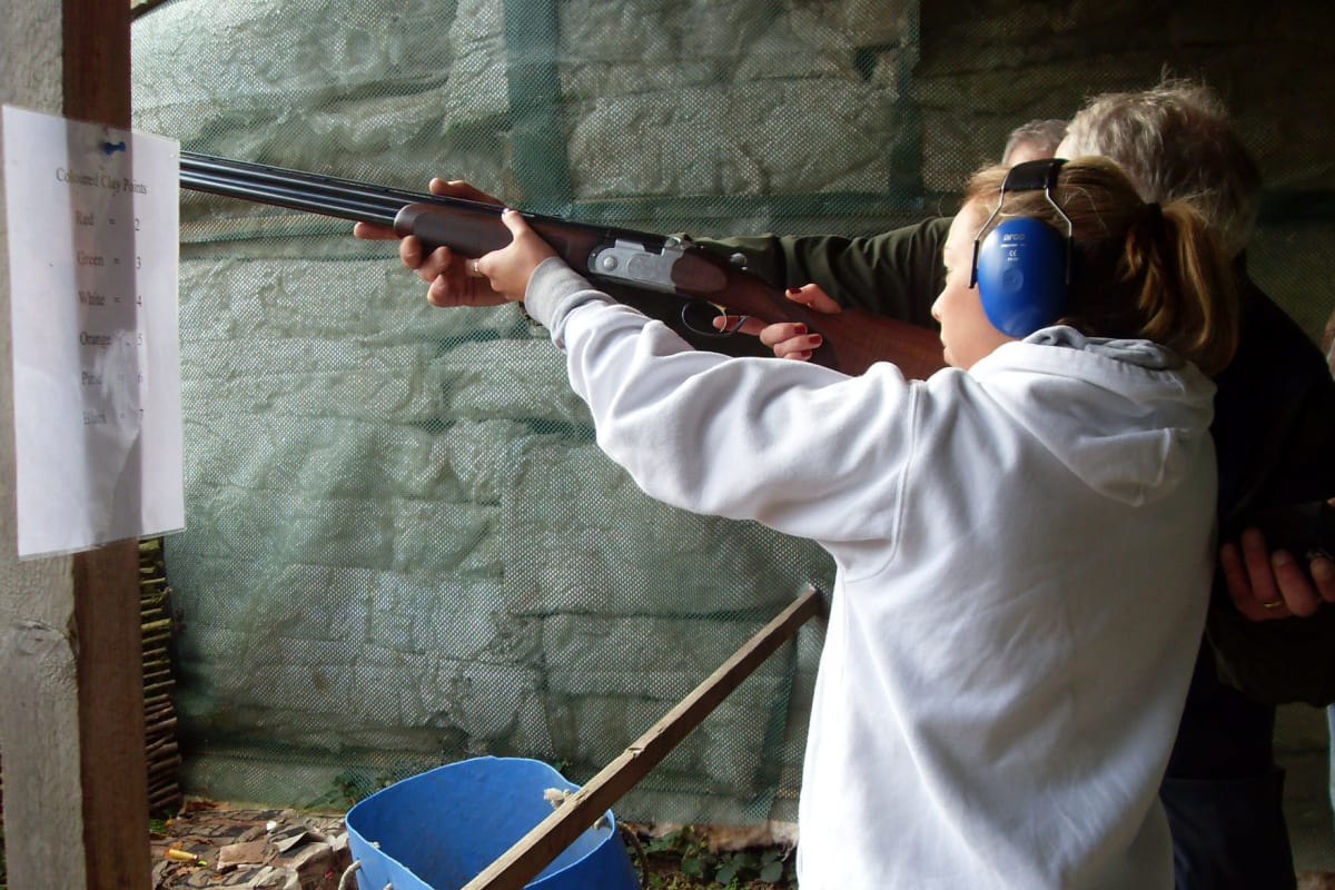 A woman shoots clays