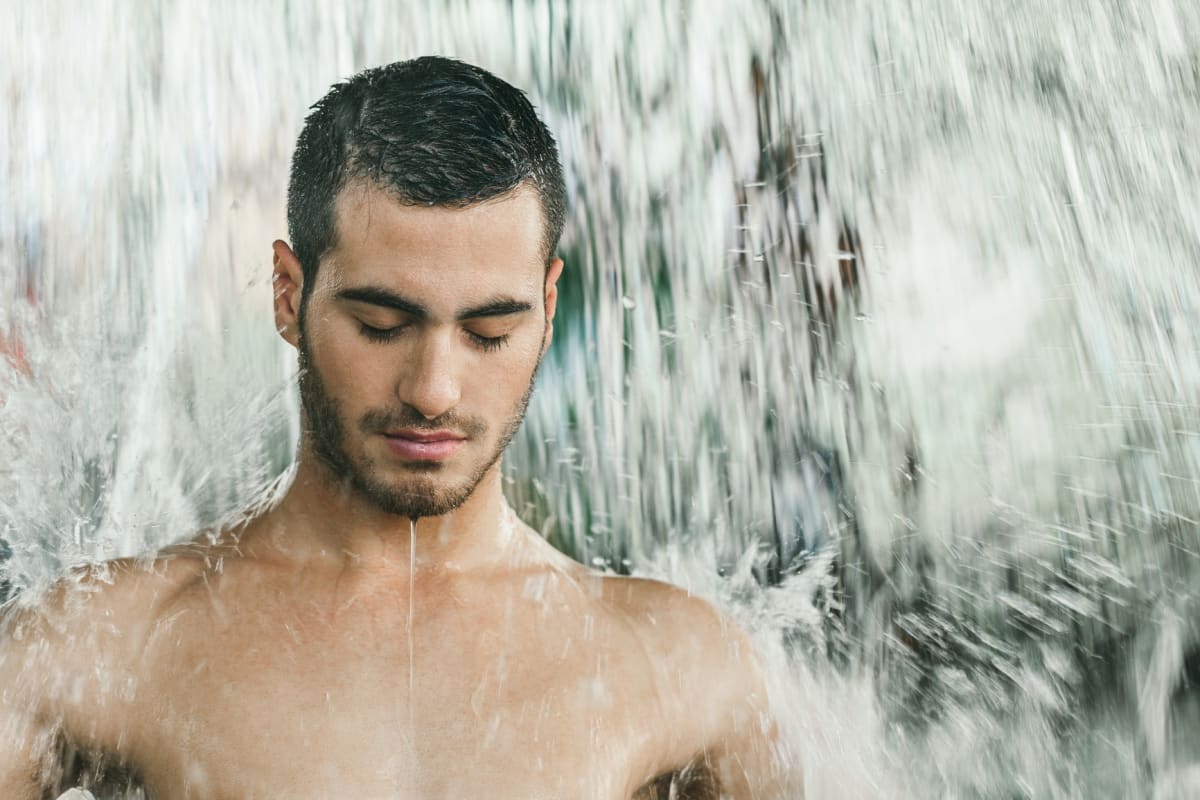 Man in aromatherapy shower in spa