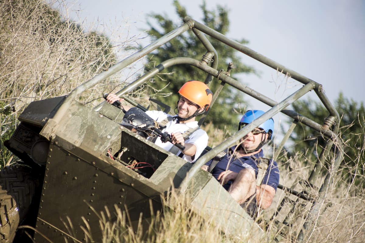 An image of a man on a argocat vehicle