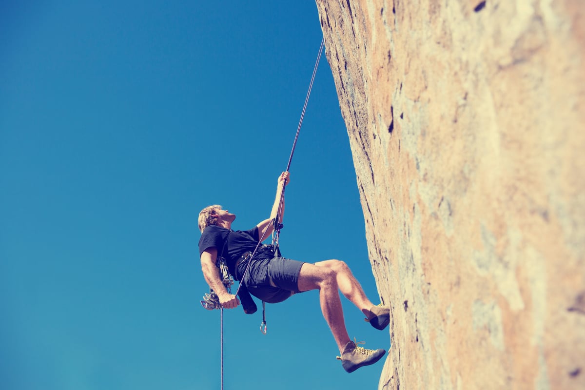 Abseiling climbing