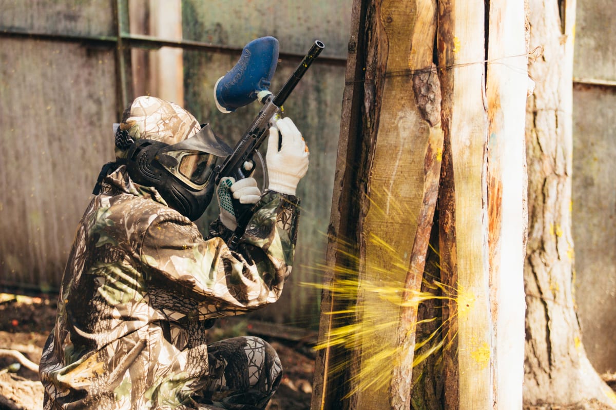 an image of a person playing paintball