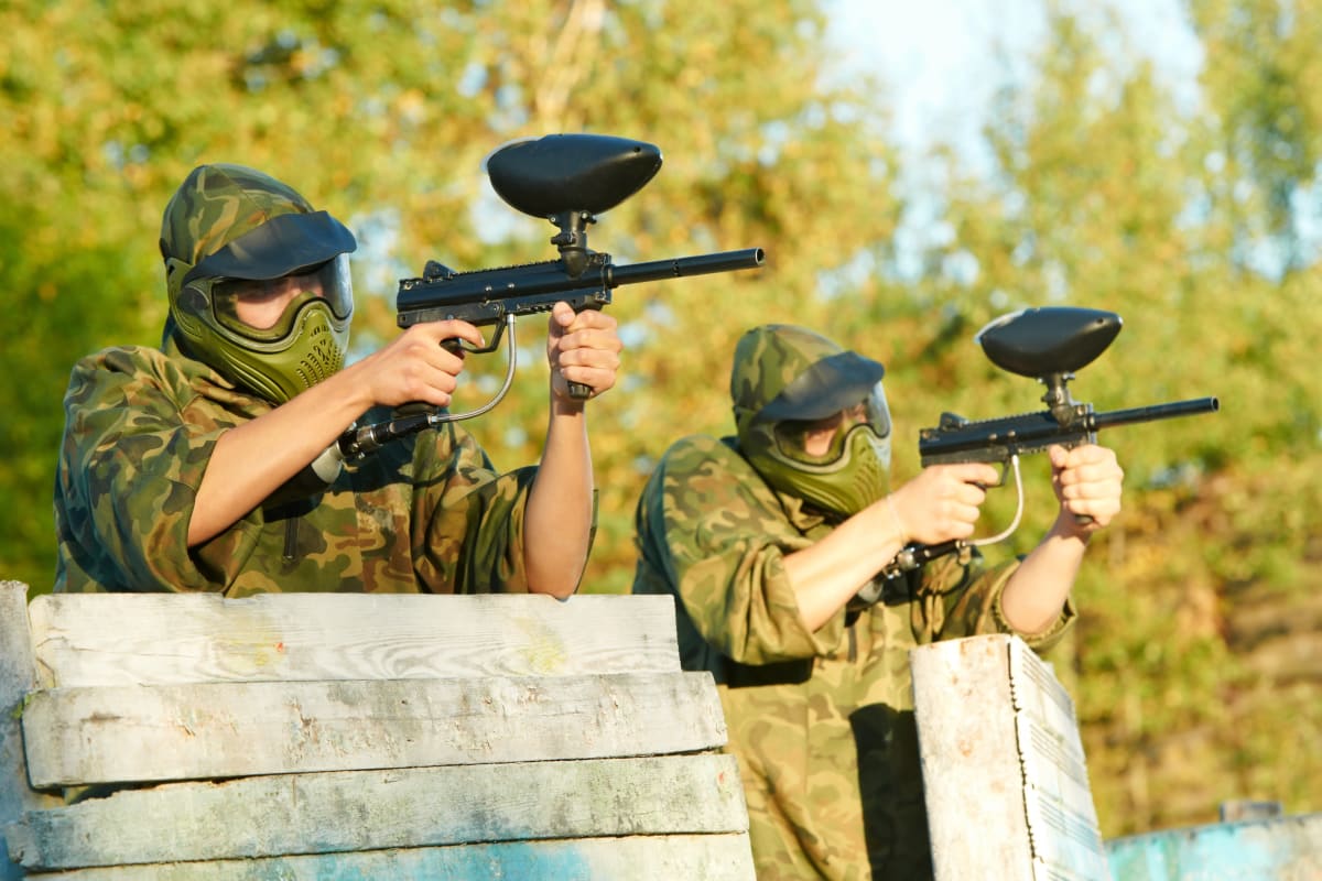 A group of people enjoying a game of paintball