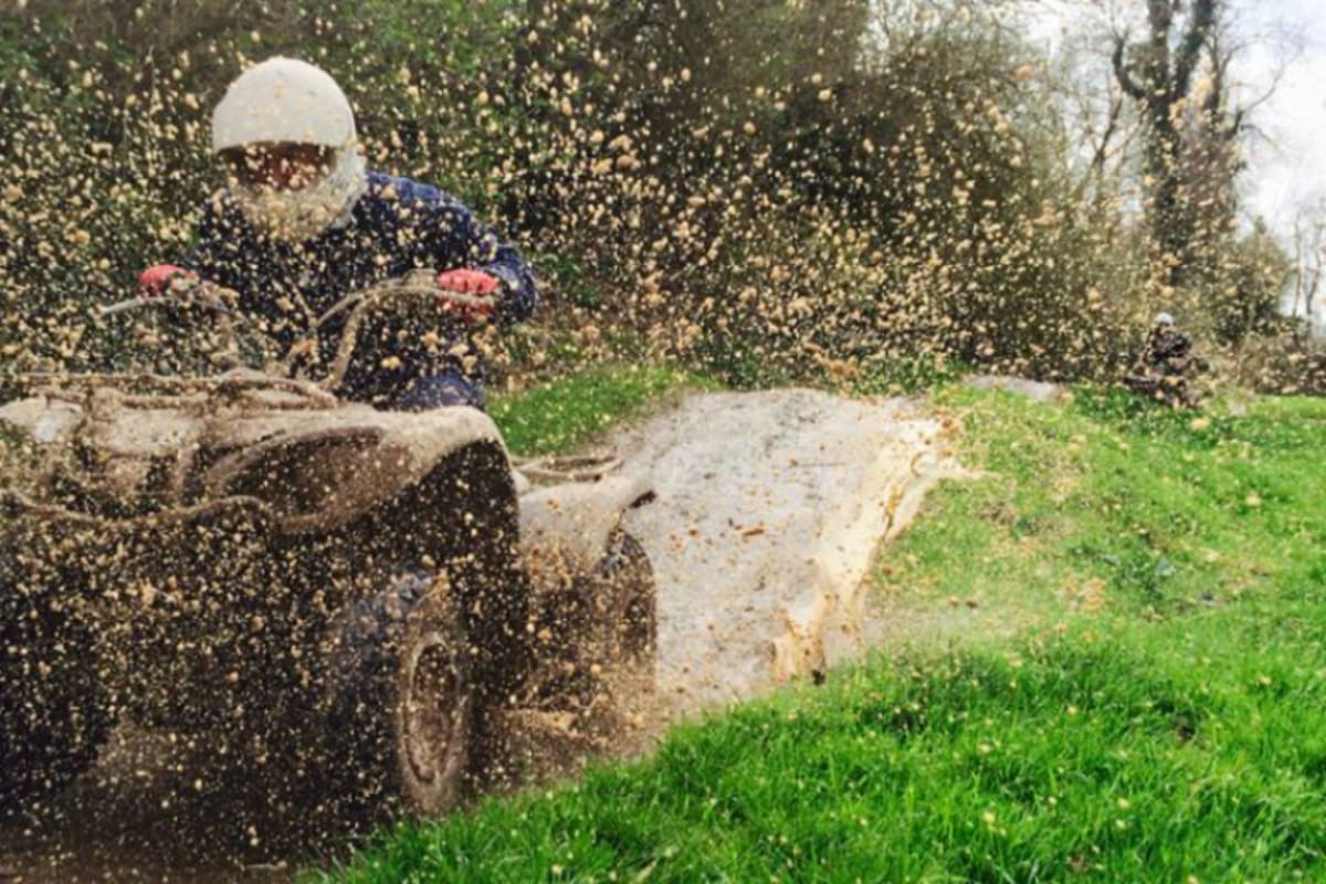 Gorcombe - Quad biker riding through mud