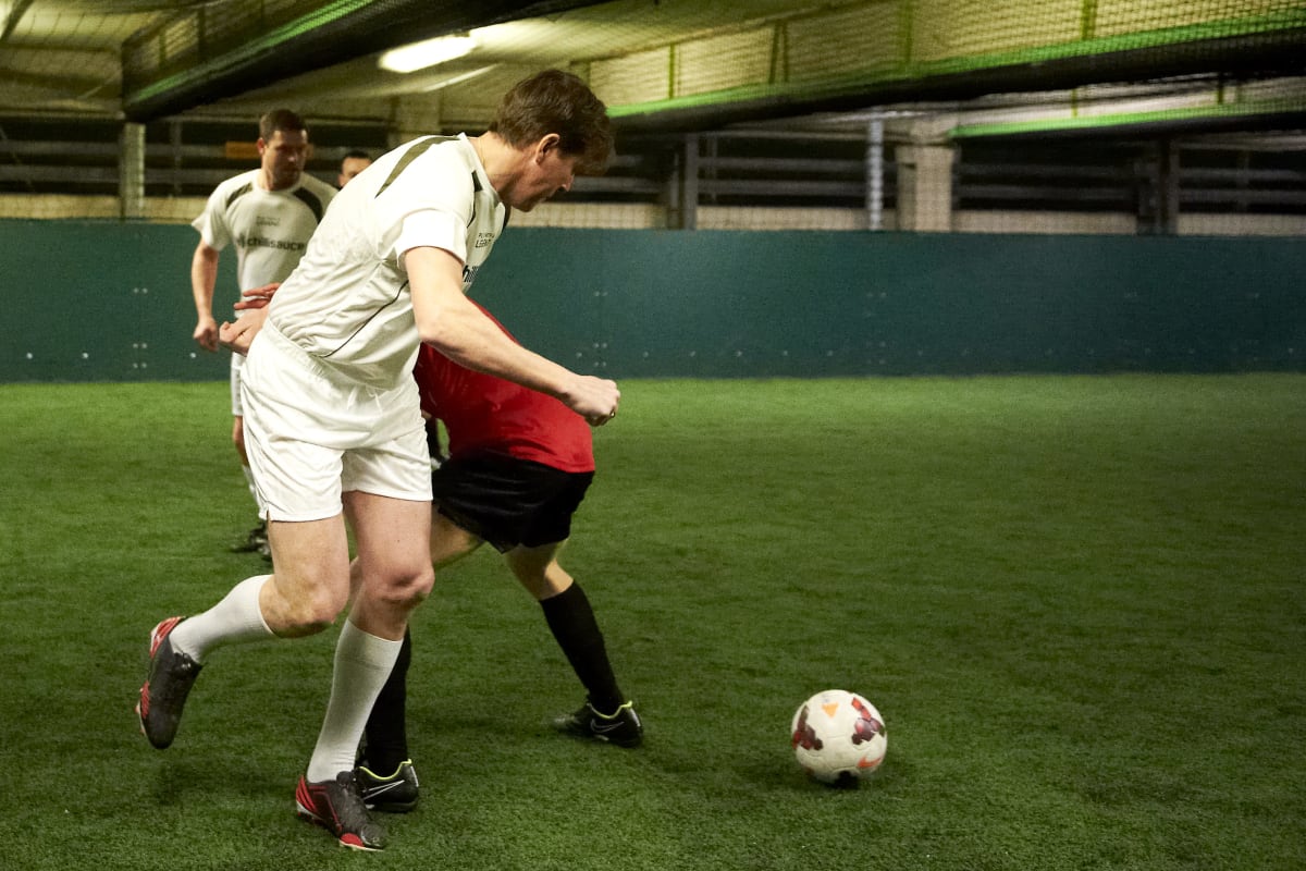 A stag group play five-a-side football