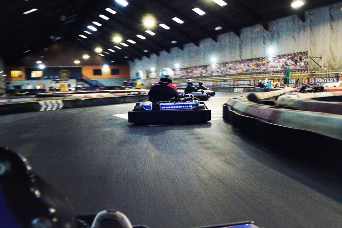 People race around a go kart track