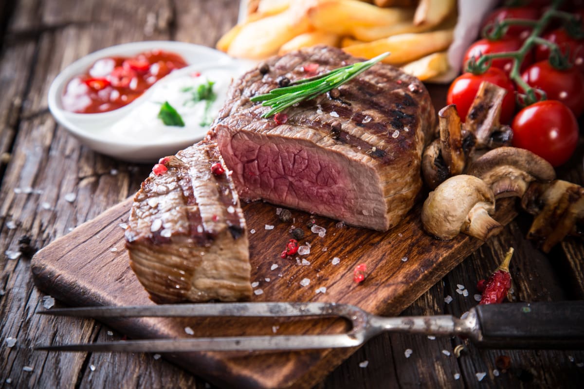 A plate of steak and chips