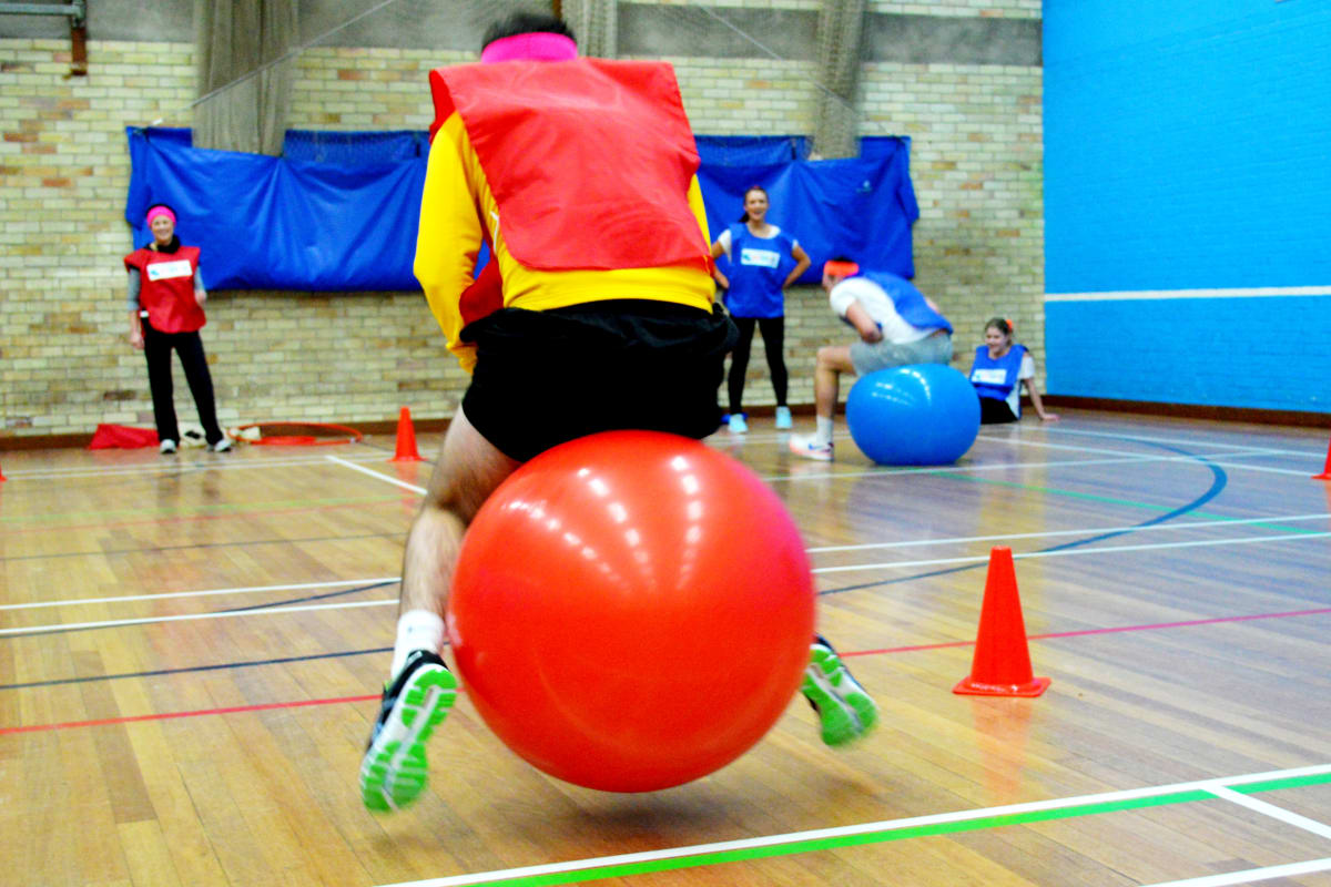 A man on a space hoper at a schools sports day