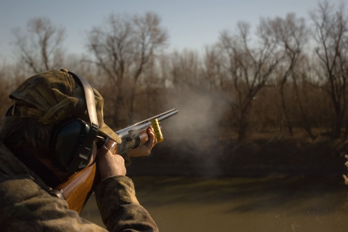 Man shooting gun during clay pigeon event