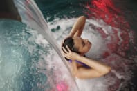 A woman relaxes during a spa session