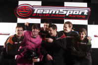 A stag group on a podium at go karting