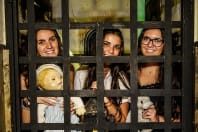 Lockdown Escape Rooms three girls behind bars