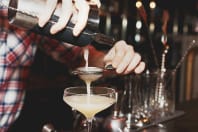 A man making a cocktail on a stag weekend