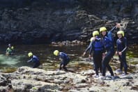 A group of girls doing coasteering