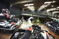 A group race go karts around a track