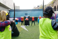 A hen party playing combat archery