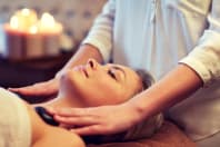 A woman receiving a relaxing head massage