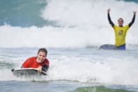 Guys doing bodyboarding