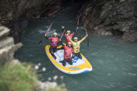 Guys on a Paddleboard