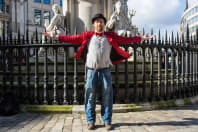 A Bull**** Tour host in front of waterfall